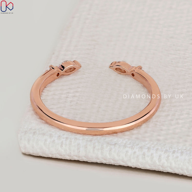 Handmade open gap wedding band with round diamonds.