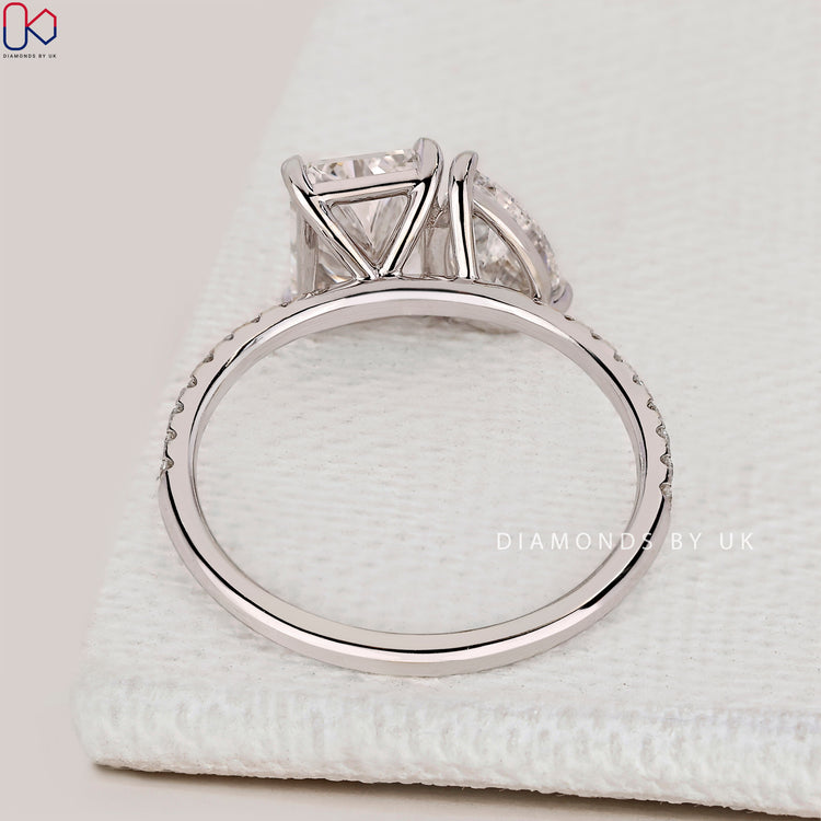 Handmade radiant and pear diamond Toi et Moi ring.