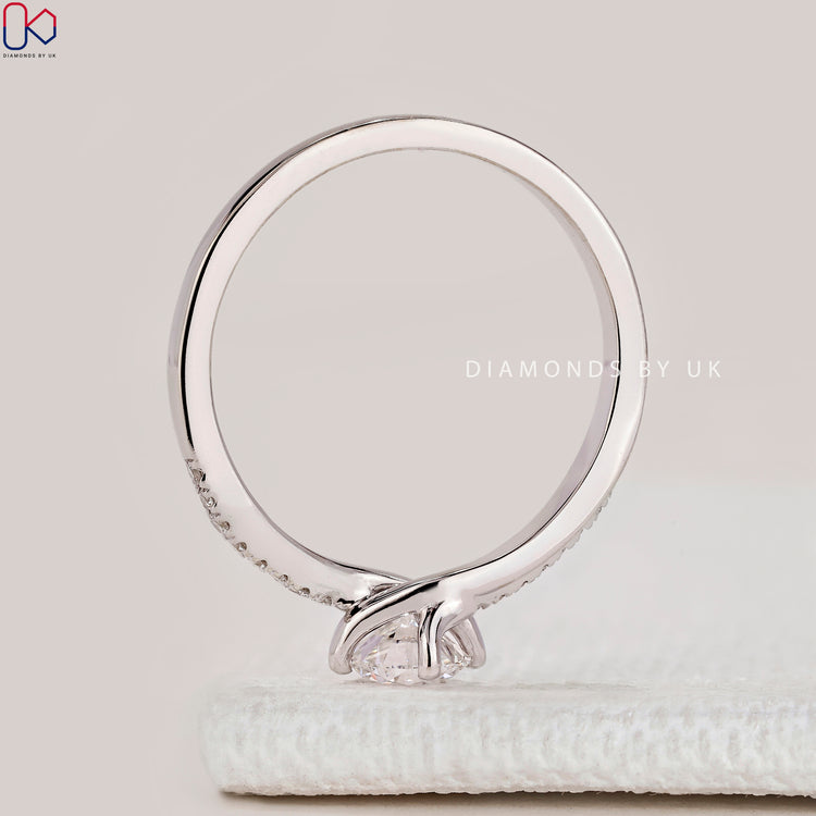 Round cut ring with bypass round diamond band.