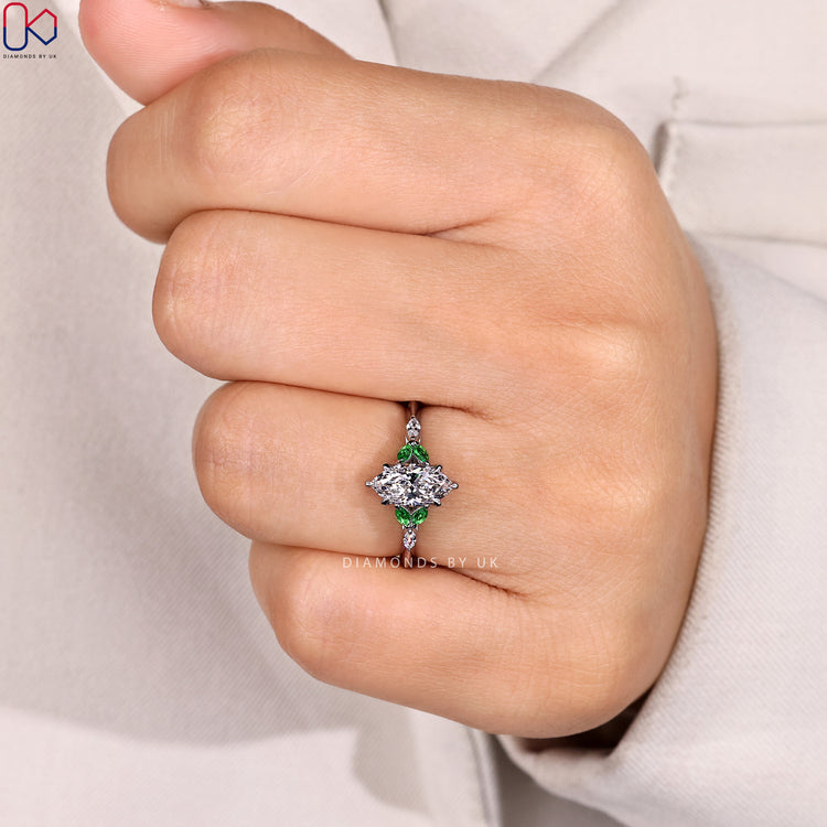 Muse setting marquise ring with six claw prongs.