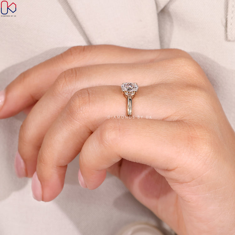 Lab grown oval ring with hidden halo setting.