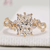 Radiant cut diamond ring with marquise and round side stones.
