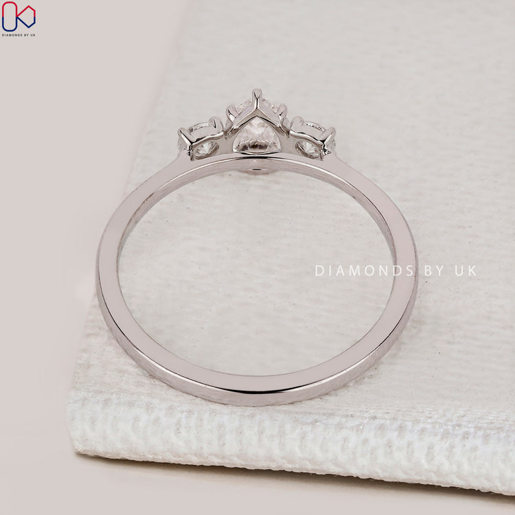 IGI Certified pear diamond three stone ring.