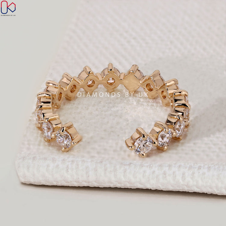 Handmade round diamond band with compass prongs.