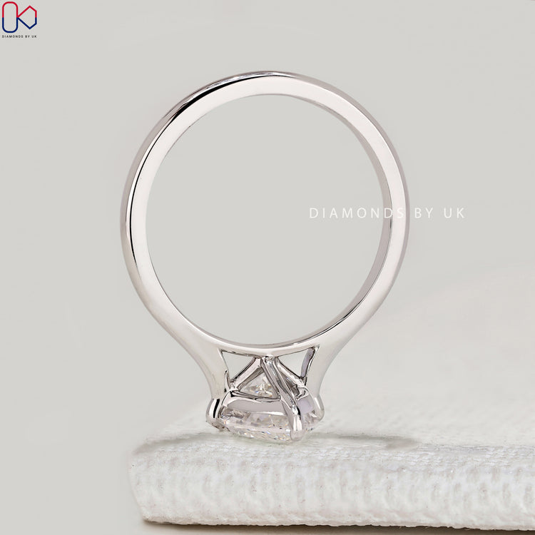 Marquise solitaire ring with tapered shank design.