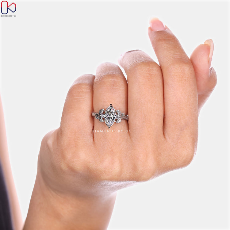 Marquise diamond ring with nature inspired setting style.
