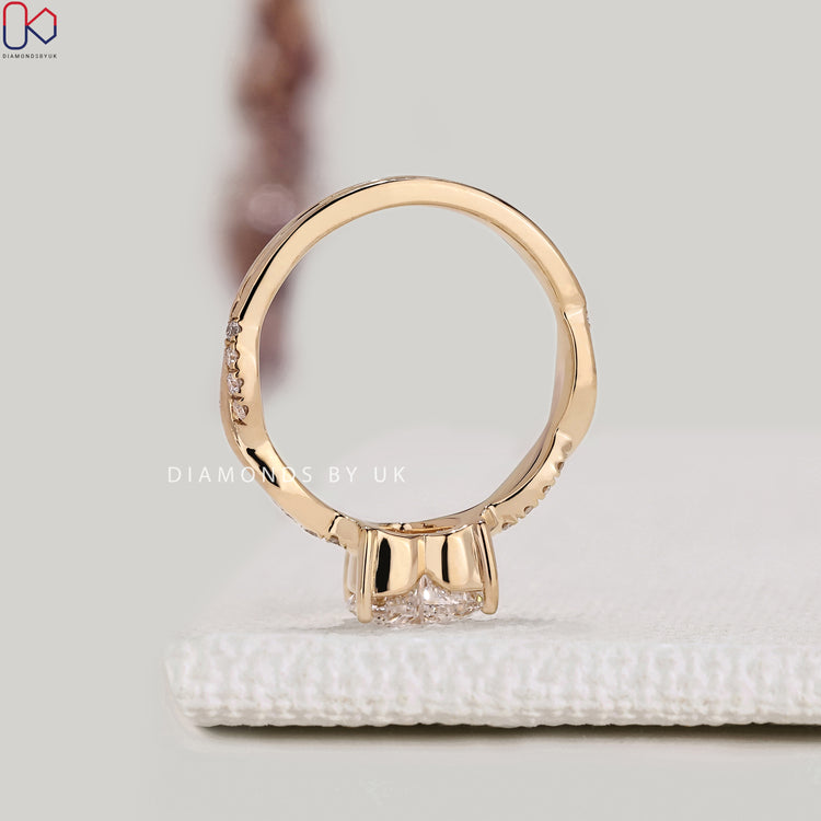 IGI certified heart cut diamond ring with V prongs.
