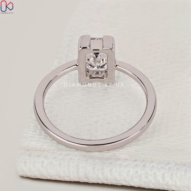 Handmade emerald cut ring with tapered shank.
