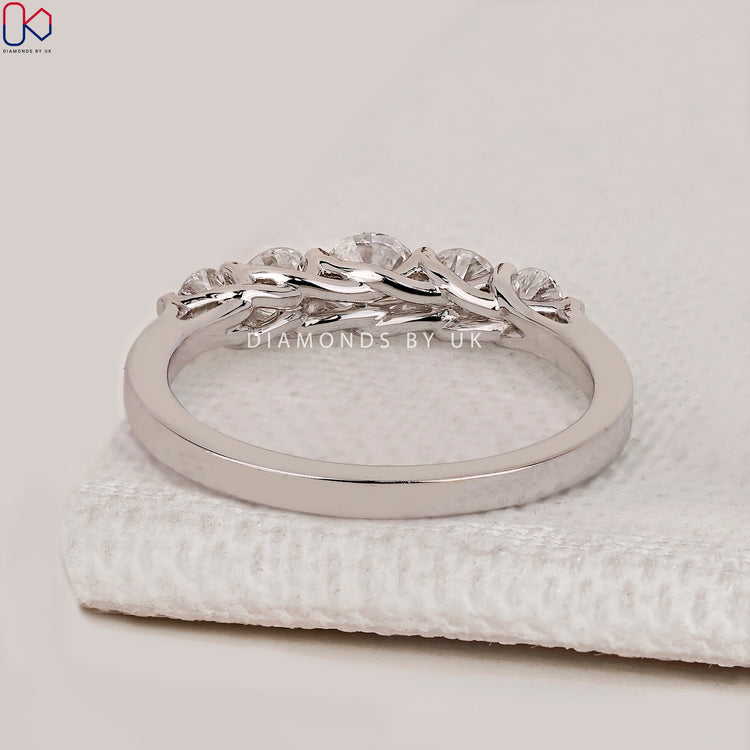 Lab grown diamond wedding band with trellis setting.