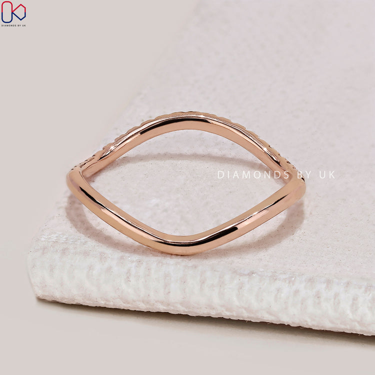 Lab grown round diamond wedding band with wave style.
