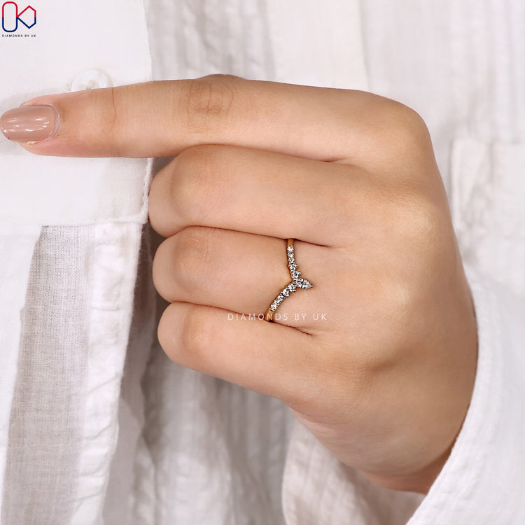 Tiara style round and marquise diamond wedding band.
