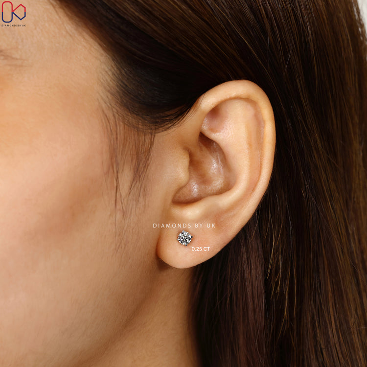Handmade round cut diamond earrings with push back setting.  