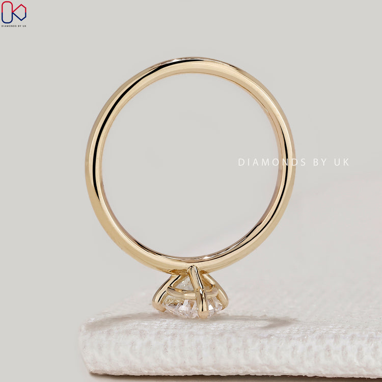Oval cut diamond ring with secure compass prongs.
