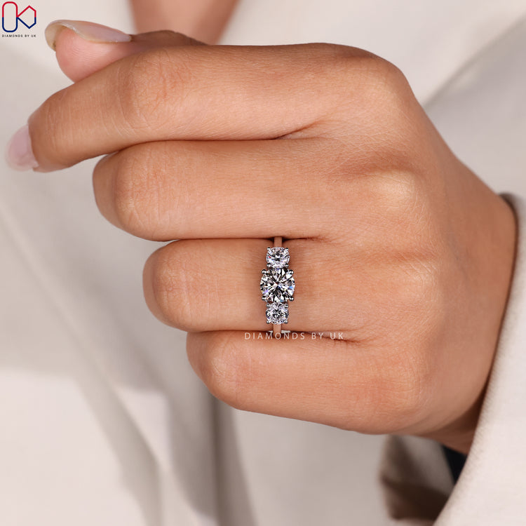 Four prong three stone lab grown diamond ring.
