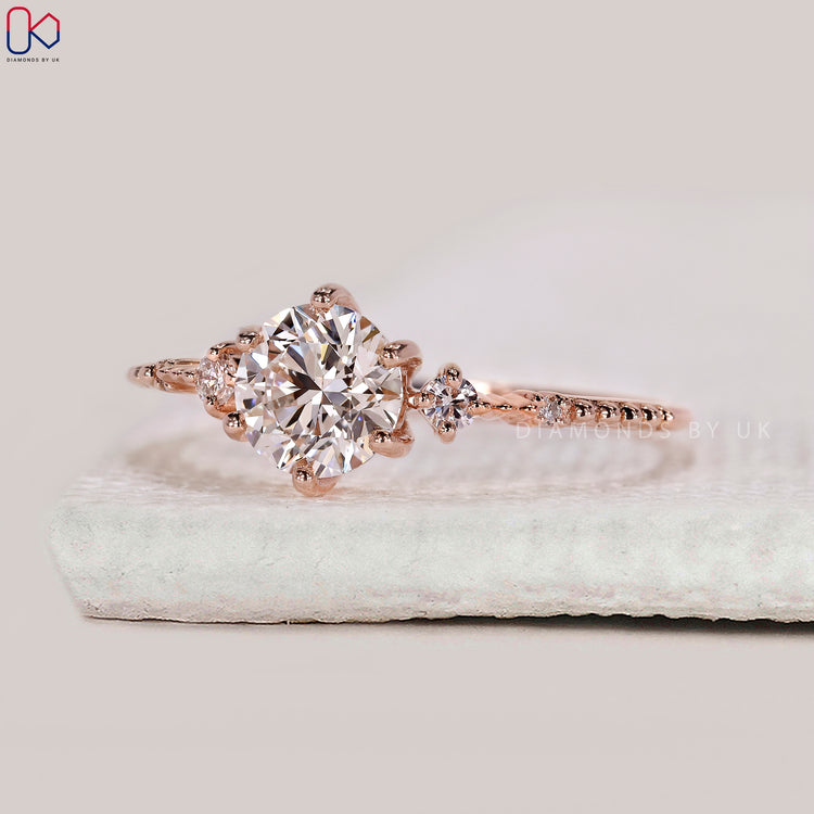 Milgrain setting five stone diamond engagement ring.
