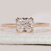 Solitaire diamond engagement ring in yellow gold.
