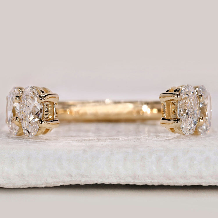 Oval diamond wedding band with open gap wedding band.
