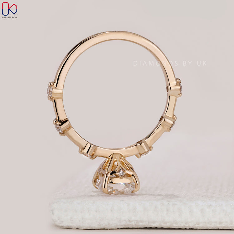 Elegant elongated cushion diamond ring by Diamondsbyuk.
