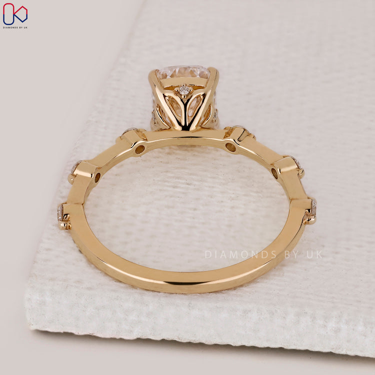 Lab grown elongated cushion cut diamond engagement ring.
