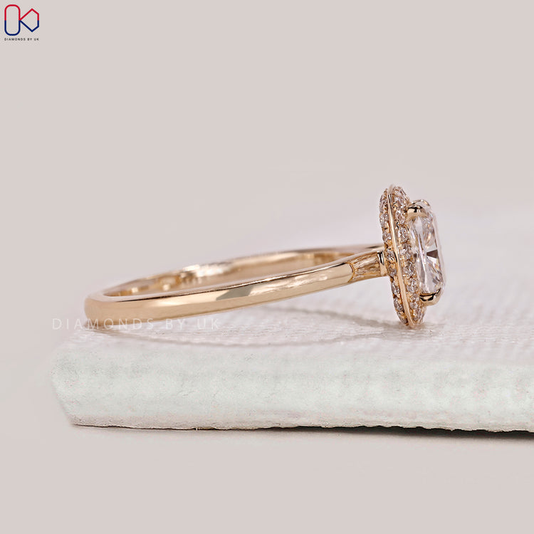 Yellow gold diamond ring with cushion cut centre stone.
