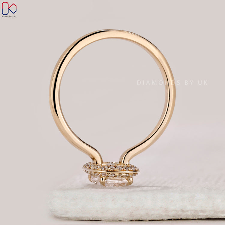Lab grown elongated cushion cut diamond engagement ring.
