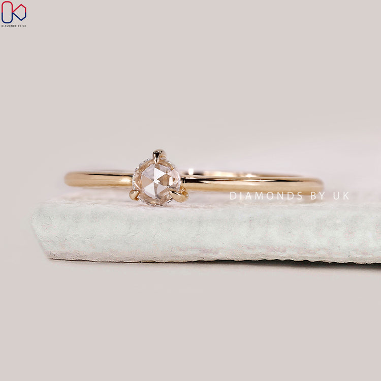 Claw prong setting securing the diamond while enhancing brilliance.
