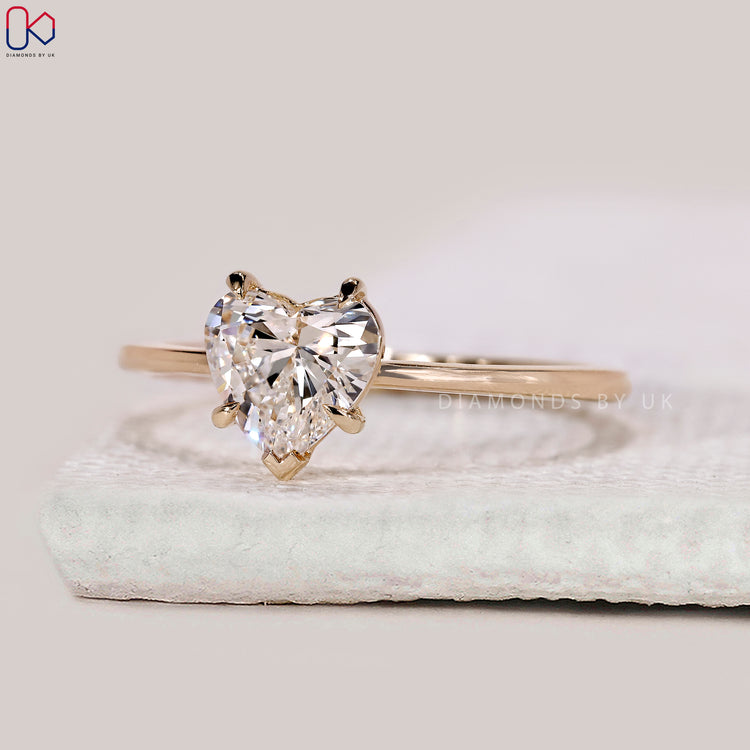 V shaped prong setting heart diamond engagement ring.
