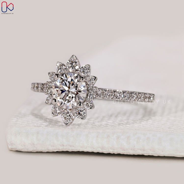 Halo diamond ring with round cut diamond.
