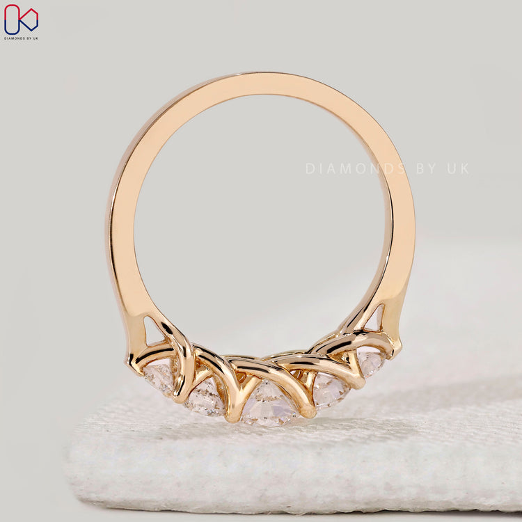 Handmade band with 5 round diamonds.
