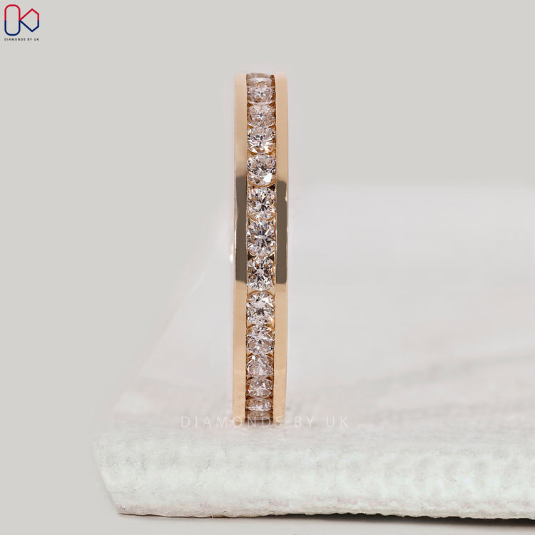 Channel set wedding band with round diamonds.
