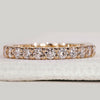 Yellow gold eternity band with round diamonds.
