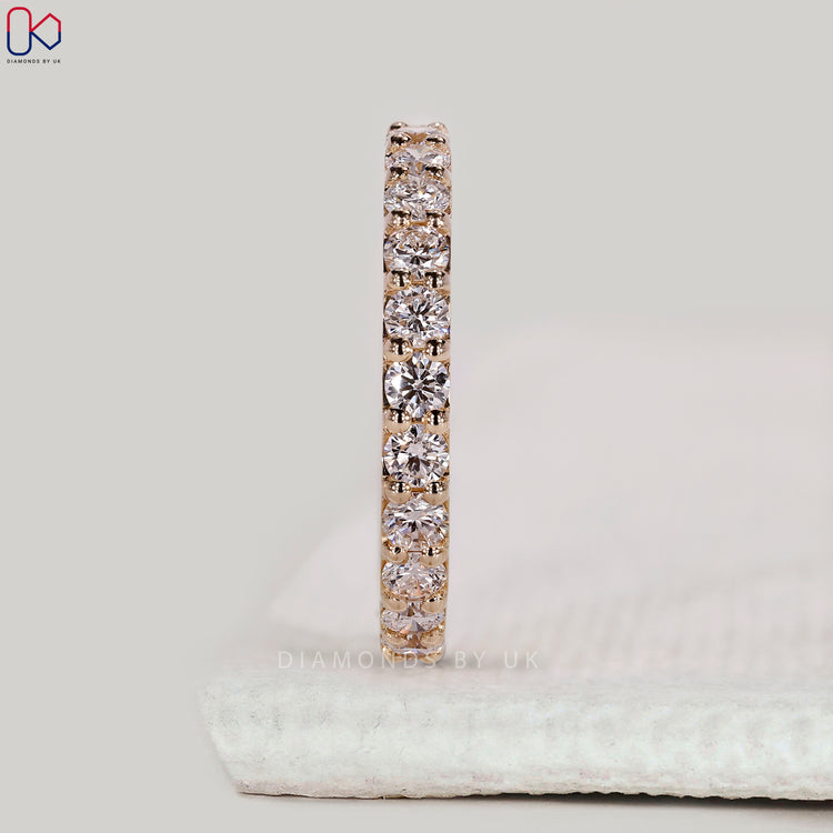 Yellow gold wedding band with full eternity design.
