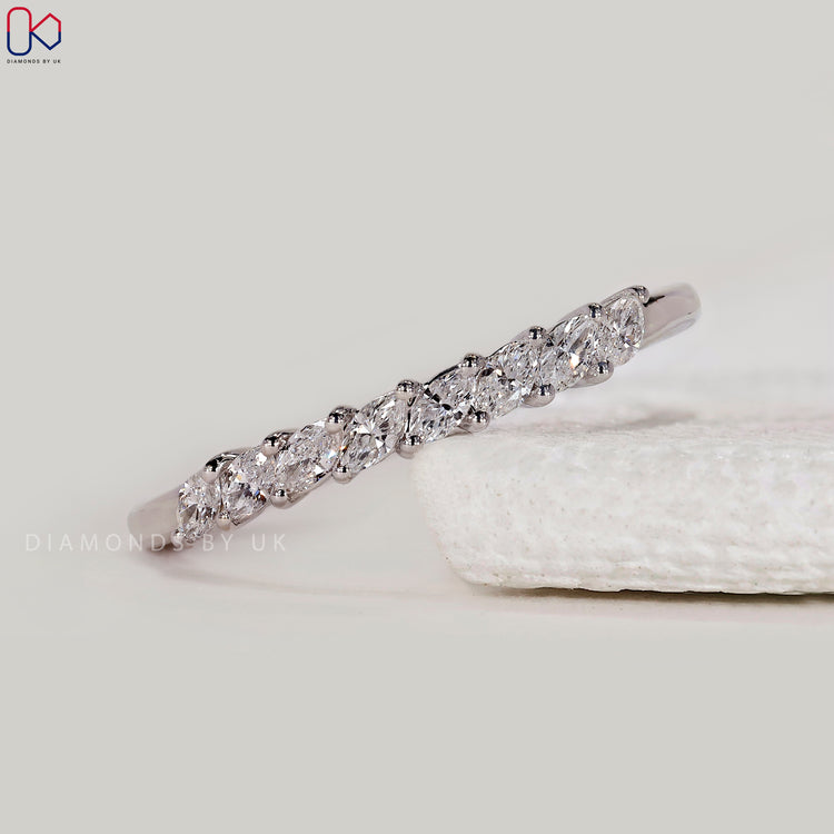 Prong setting wedding band with marquise diamonds.
