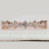 Round diamond half eternity band in yellow gold.
