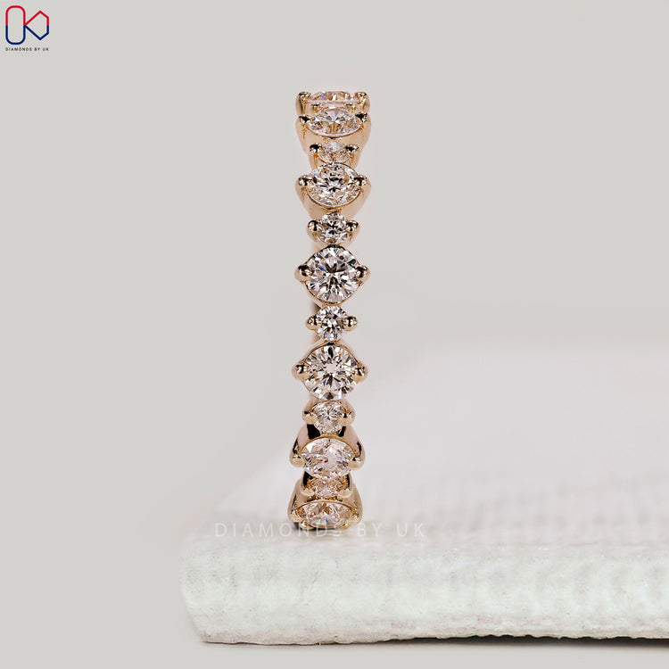 Yellow gold wedding band with round diamonds.
