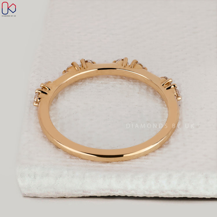 Handmade band with distance pave diamonds.
