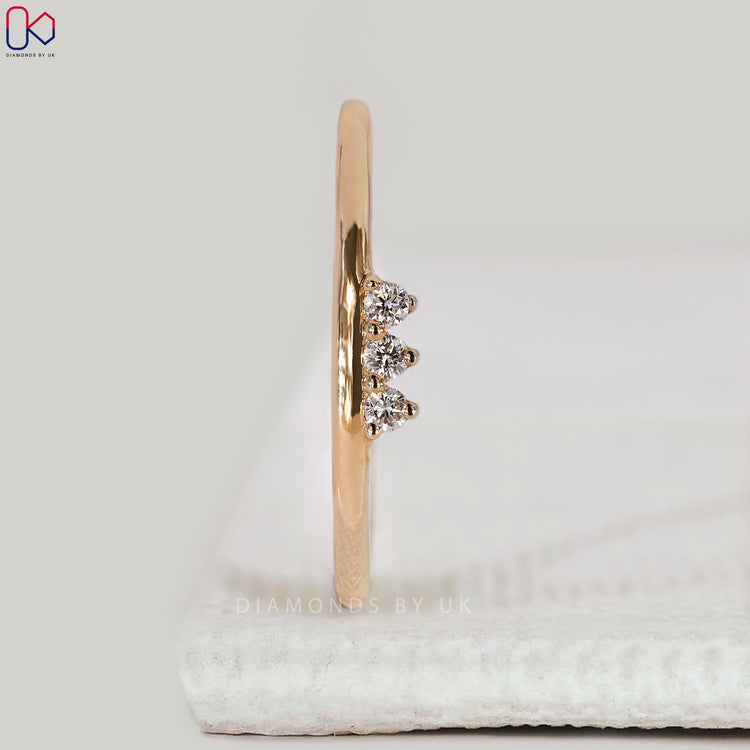 Shared prong wedding band with 3 stones.
