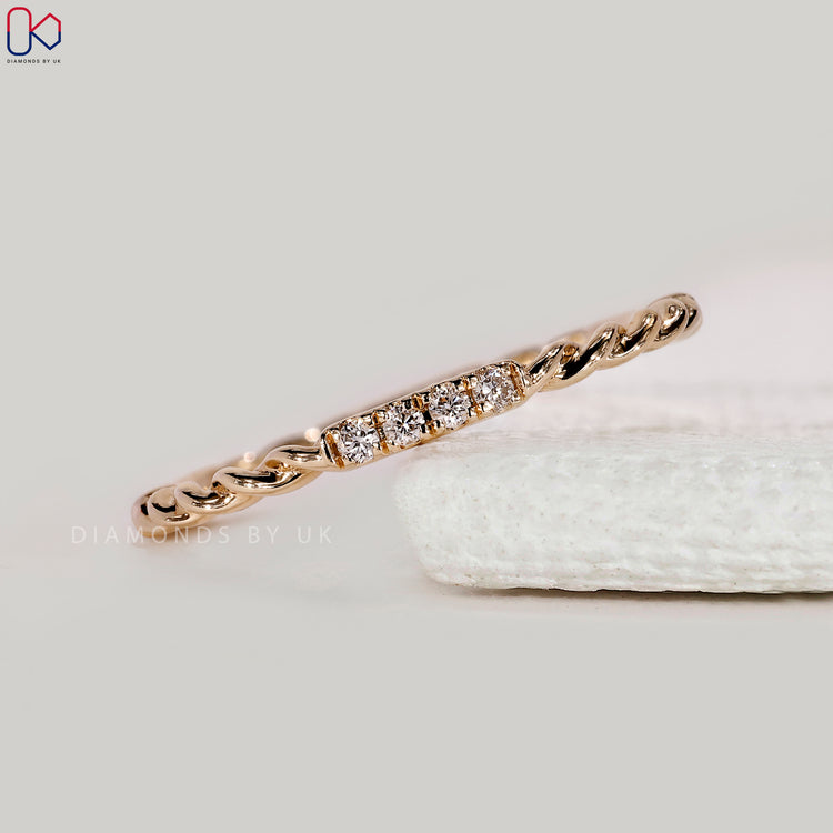 Yellow gold band with round diamond eternity design.
