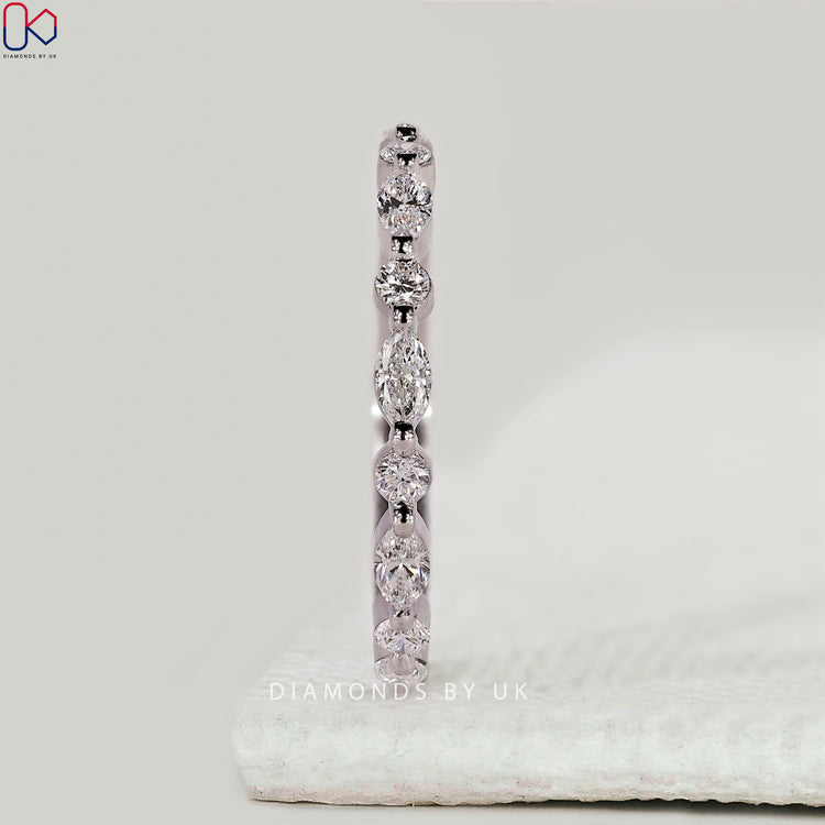 Handmade marquise and round diamond half eternity band.