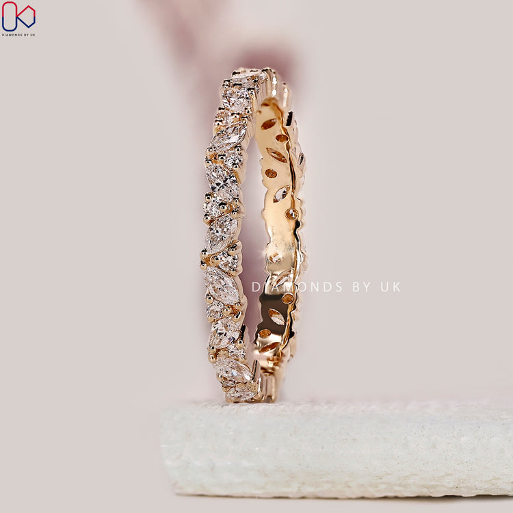 Round diamond wedding band handmade with precise prong settings for extra security.
