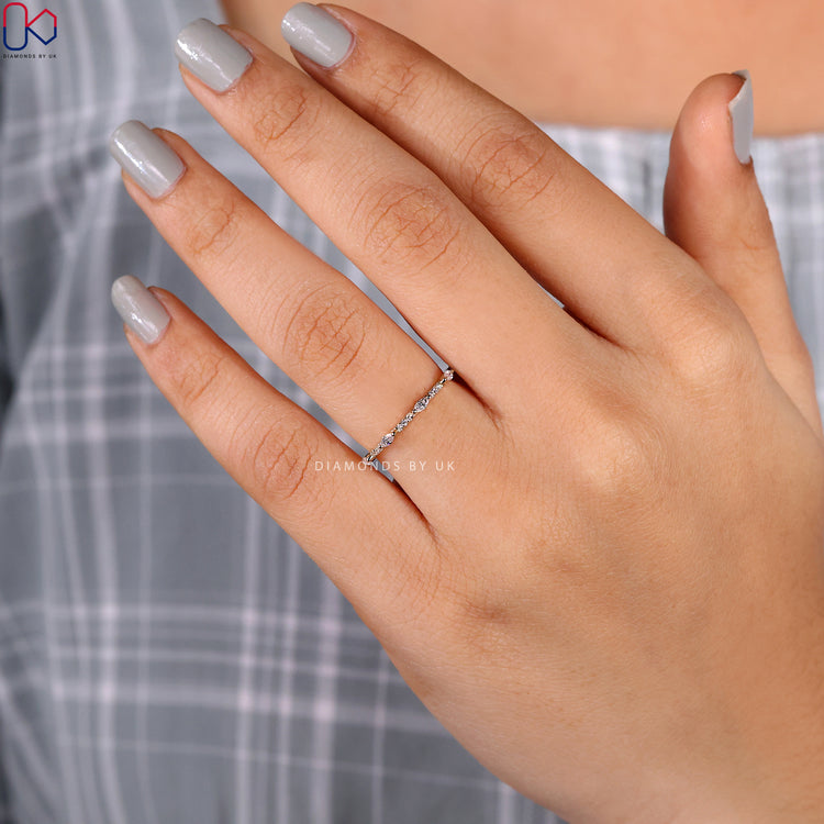Yellow gold wedding band handmade with a marquise and round diamond pattern.
