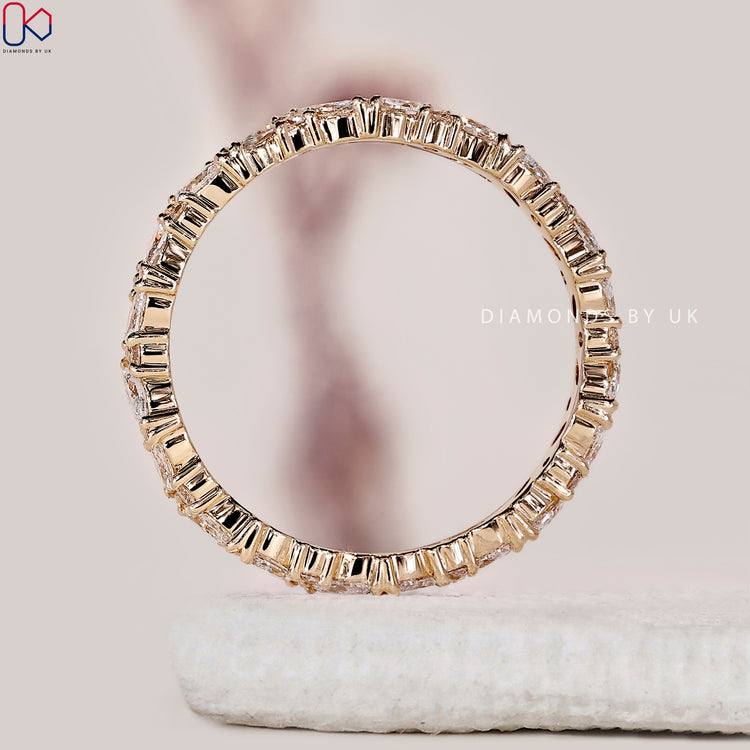 Marquise and round diamond wedding band designed for complete stone coverage.
