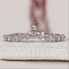 Marquise and round diamond band with chevron style.
