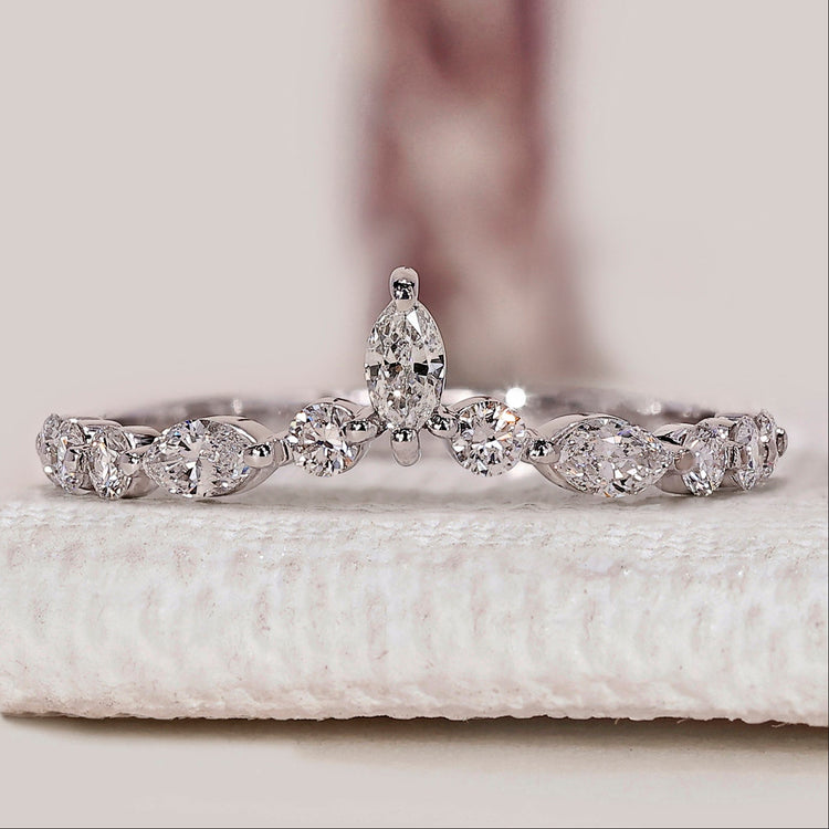Marquise and round diamond band with chevron style.
