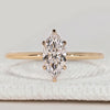 Marquise cut solitaire ring with six claw setting.