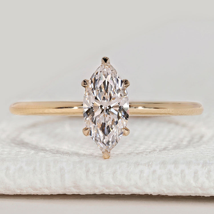 Marquise cut solitaire ring with six claw setting.
