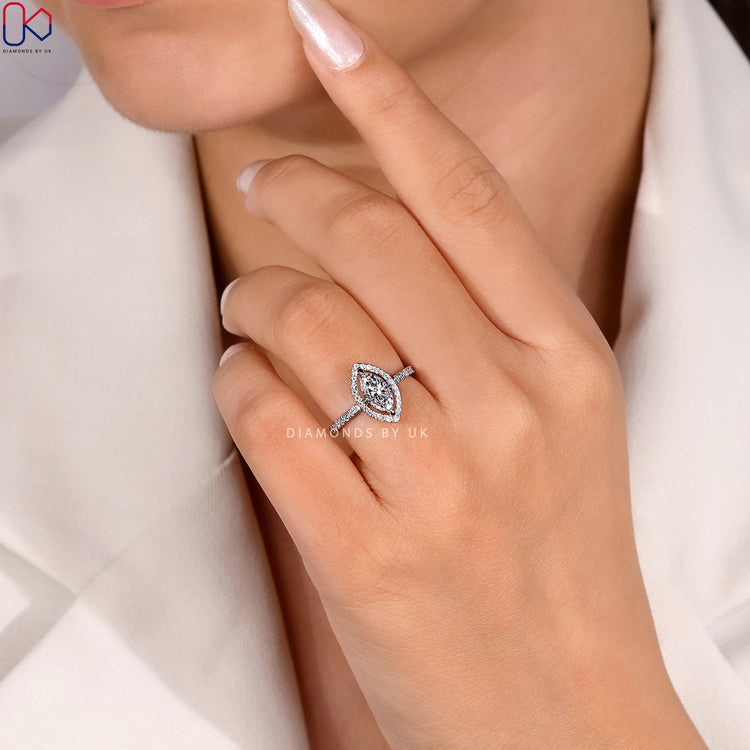 Marquise cut ring with round diamond pavé band.
