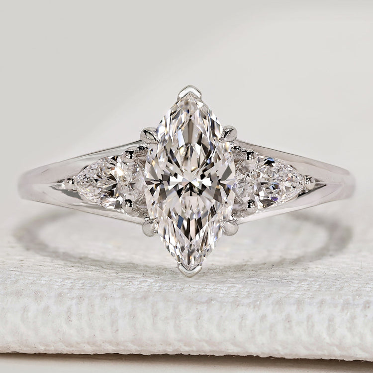 Marquise cut ring with pear side stone style.
