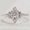 Marquise cut three stone ring with side stones.
