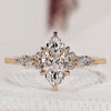 Marquise cut ring with round side stones design.